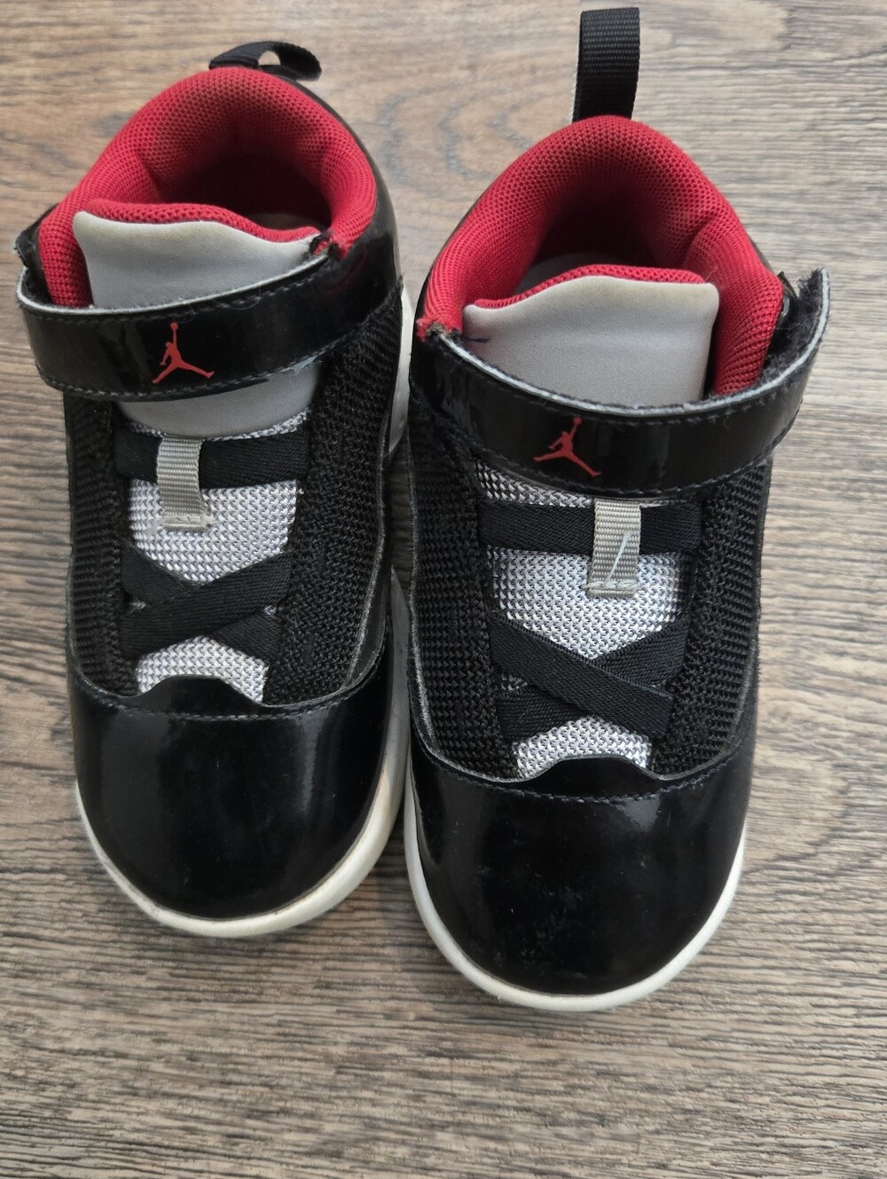 Jordan Kids Black and Red High-Top Sneakers